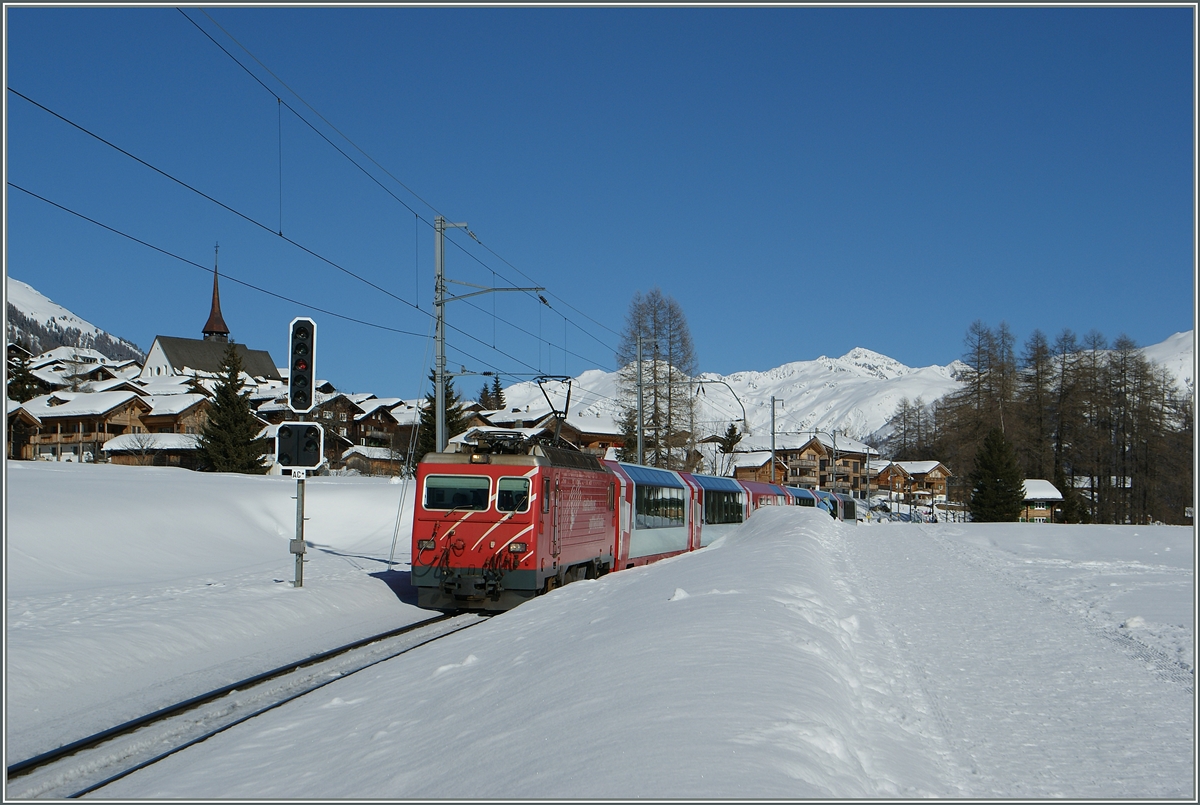 Der Glacier Express 903 von St. Moritz nach Zermatt passiert gerade das Einfahrsignal A (mit dem Ausfahrvorsiganl C*) bei Münster VS.
20. Feb. 2014