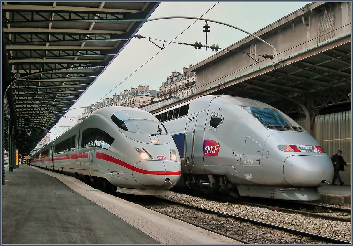 ICE und TGV in Paris Est am 21. Januar 2008. Immer wieder faszinierend und seit Jahren unverändert: die nostalgisch anmutenden Fahrleitungs - Querträger.