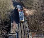 br-646-stadler-gtw-2-6 Ich befinde mich am 05.02.2012 �ber dem Herdorfer Tunnel, unten auf der KBS 462 f�hrt die Hellertalbahn mit einem Ihrer Stadler GTW 2/6 in Richtung Betzdorf, gleich geht es �ber die Heller und die Landstra�e.