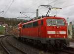 Die 111 015-4 schiebt am 30.01.2013 den RE 9 - rsx Rhein-Sieg-Express (Siegen - Kln - Aachen) in den Bahnhof Betzdorf/Sieg.