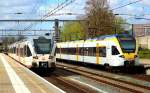 So etwas wie ein Stadler-Familientreffen: Zwei GTW 2/8 der Veolia, die die Maaslijn von Roermond nach Nijmegen betreibt, und der ET 7.14 der Eurobahn nach Hamm/Westfalen begegnen sich am 17.04.2015 im