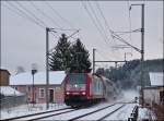 serie-4000-traxx-p140-ac1/239111/--schnee-in-luxemburg---die - Schnee in Luxemburg - Die 4004 durchf�hrt mit dem IR 3714 Luxembourg - Troisvierges die verschneite Ortschaft Enscherange. 07.12.2012 (Jeanny)
