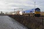 class-66-emd-jt42cwr/760897/railtraxx-266-009-zieht-ein-kesselwagenzug RailTraxx 266 009 zieht ein Kesselwagenzug durch Tilburg-Reeshof am 22 Dezember 2021.