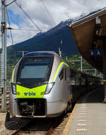 Der BLS MIKA 110 (in Regioexpress-Ausführung) - RABe 528 110 (94 85 7528 110-0 CH-BLS) steht am 25 Mai 2023, als RE nach Bern im Bahnhof Brig zur Abfahrt bereit.