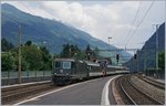 Die grüne Re 4/4 II 11161 errreicht mir einem  Gotthard  IR Faido.