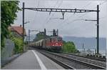 Die SBB Re 4/4 II 11322 und weiterhin die Re 4/4 II 11275 sind mit ihrem (leeren) Transit-Getreide-Blockzug von Italien auf der Rückfahrt nach Frankreich bei St-Sahorin am Genfer See unterwegs. 11. Mai 2020