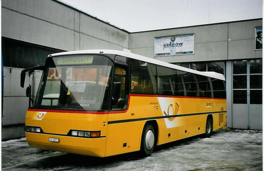 (065'404) - Geissmann, Hgglingen - AG 8571 - Neoplan am 7. Februar 2004 in Adelboden, Mineralquelle