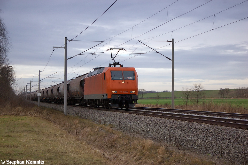 145-CL 002 (145 082-4) ArcelorMittal Eisenhttenstadt Transport GmbH mit einem Kohlenstaub Kesselzug bei Nennhausen und fuhr in Richtung Wustermark weiter. 31.12.2012