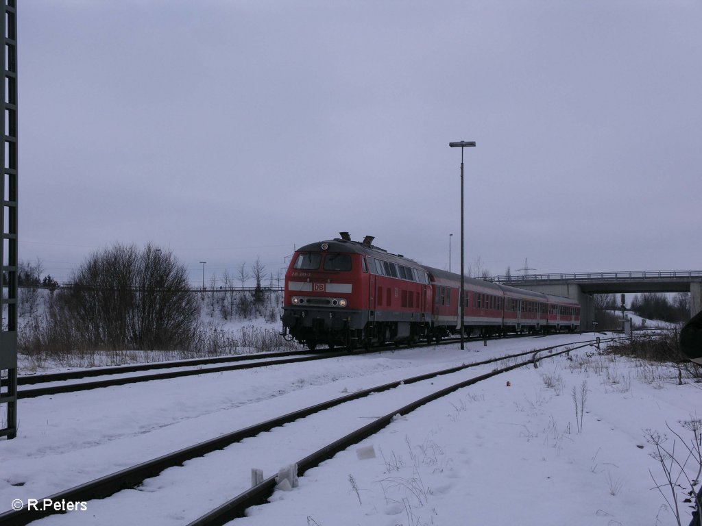 218 390-3 f�hrt in Buchloe mit einer RB M�nchen ein. 25.02.09