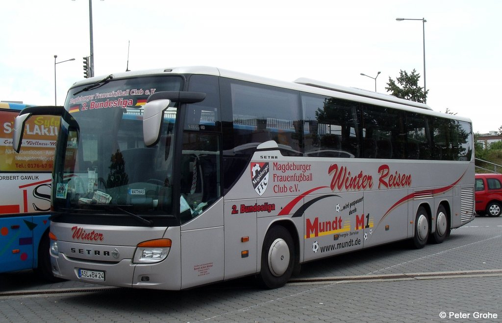 Setra S 416 GT-HD von Omnibus- und Taxiunternehmen Bernd-Achim Winter aus Egeln mit Werbung fr Magdeburger Frauenfuball Club e.V. und Mundt Energie-Service, fotografiert am Hauptbahnhof Dessau am 07.07.2012