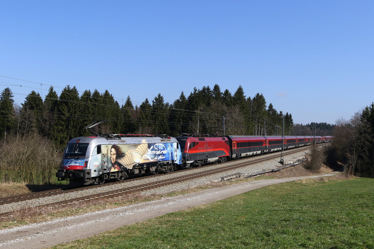 1216 019  Leonardo da Vinci  vorgespannt an einem Railjet aus Salzburg. Aufgenommen am 18. Mrz 2020 bei Grabensttt im Chiemgau.