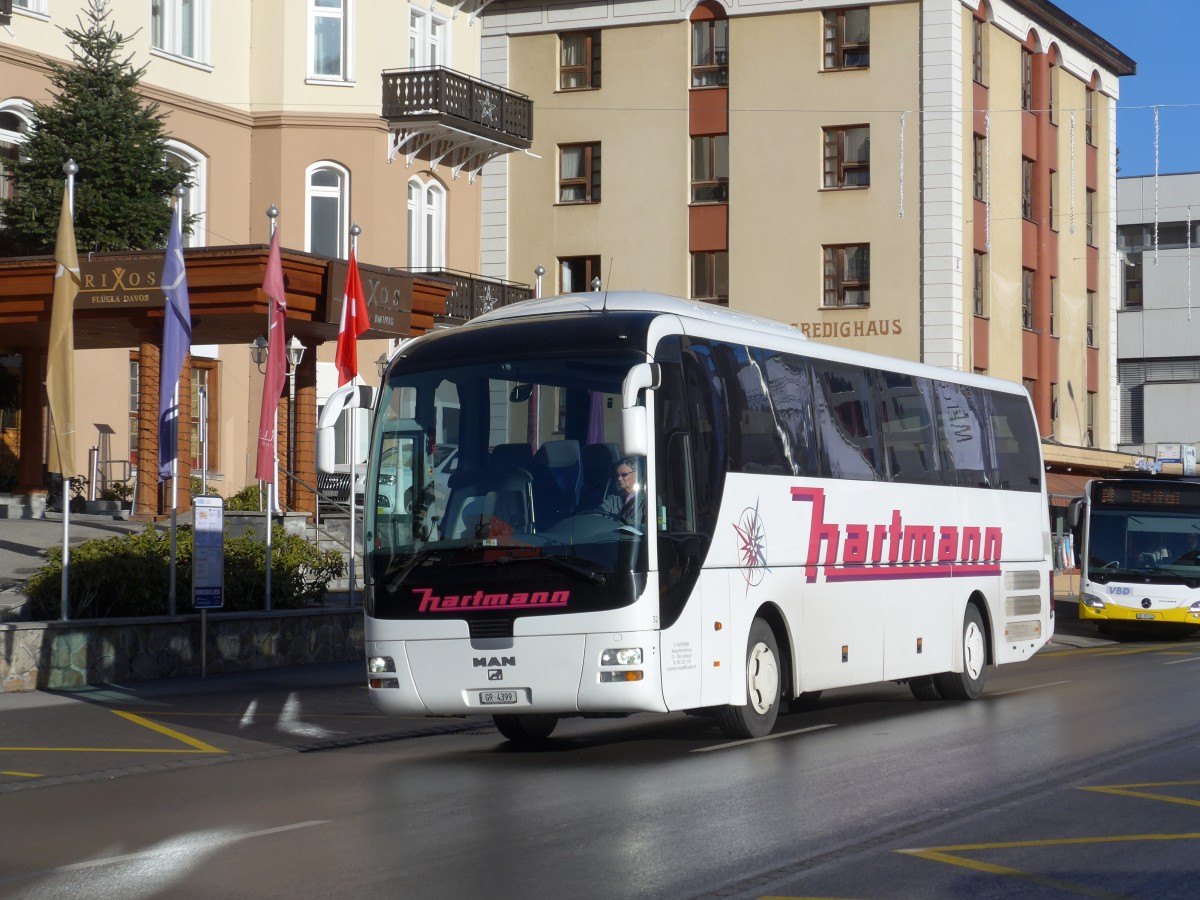 (167'790) - Hartmann, Landquart - Nr. 32/GR 4399 - MAN am 19. Dezember 2015 beim Bahnhof Davos Dorf