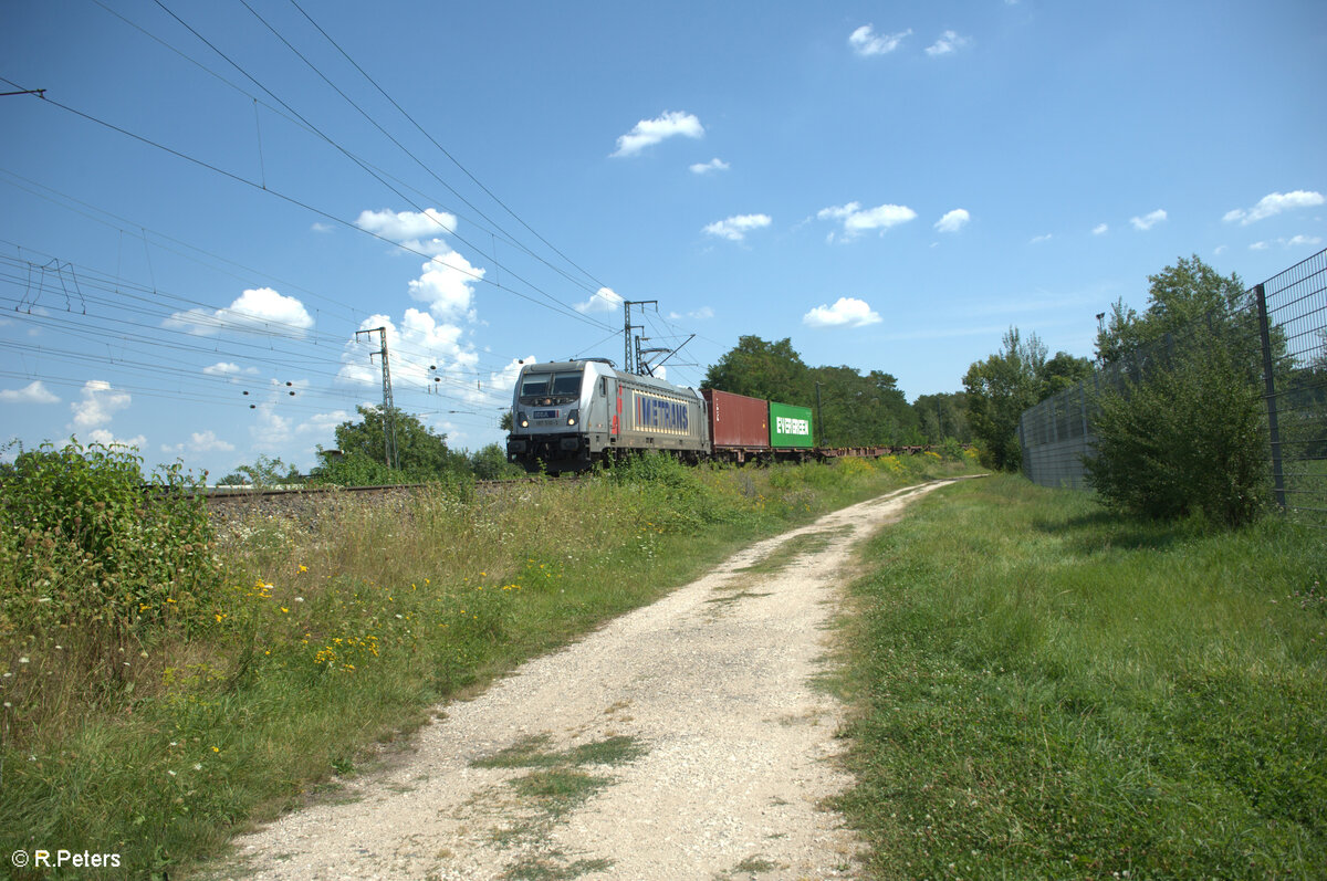 187 510-3 durchfährt die Treuchtlinger Kurve mit einem Containerzug in Nürnberg Hohe Marter. 13.08.24