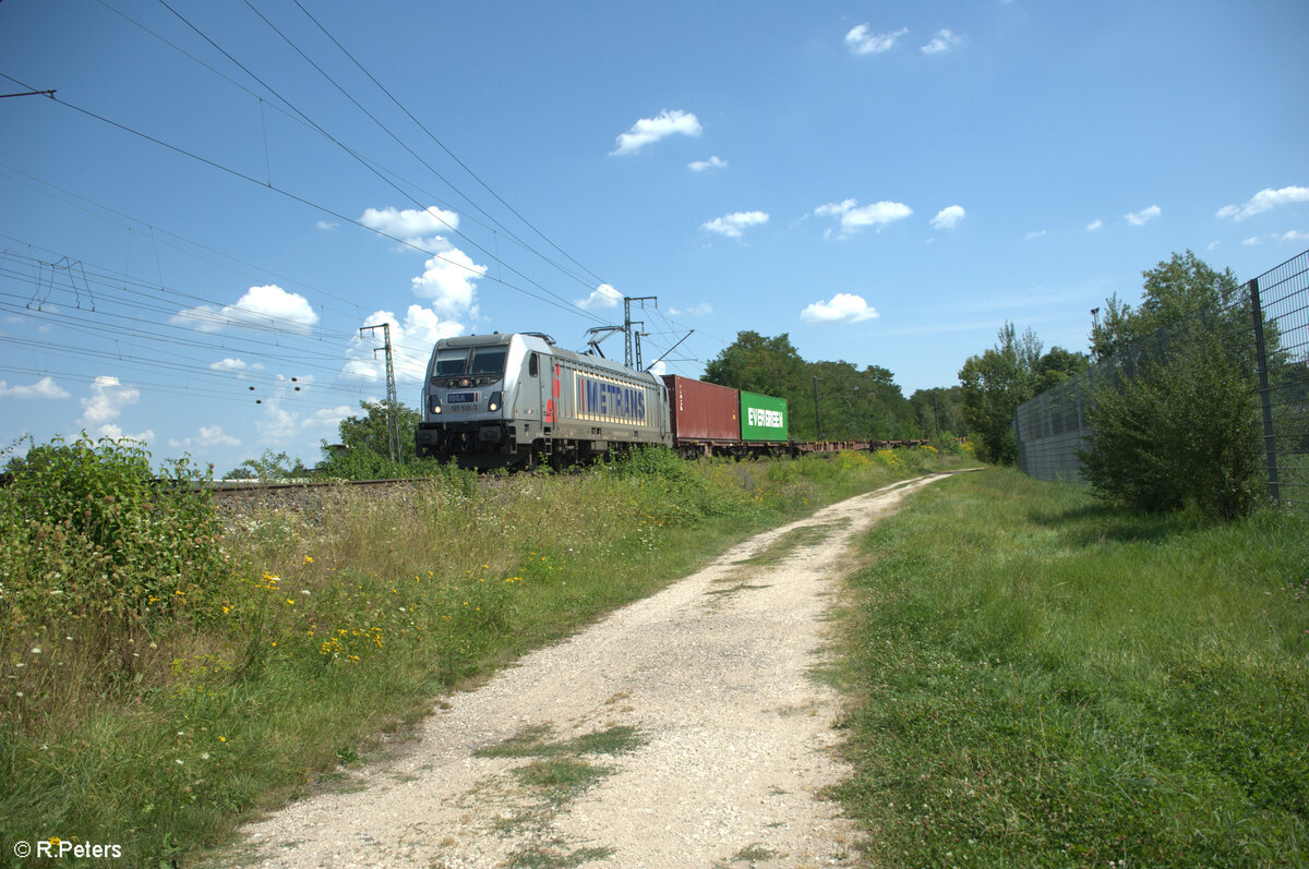 187 510-3 durchfährt die Treuchtlinger Kurve mit einem Containerzug in Nürnberg Hohe Marter. 13.08.24