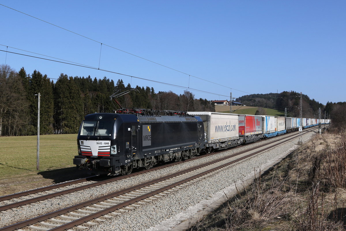 193 646 mit einem  EKOL  aus Salzburg kommend am 25. Februar 2021 bei Grabensttt im Chiemgau.