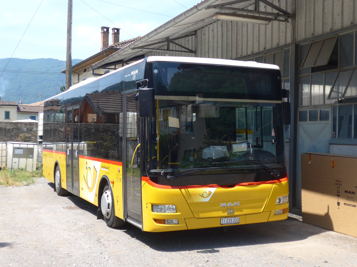 (208'044) - Merzaghi, Maroggia - TI 215'333 - MAN/Gppel (ex AutoPostale Ticino) am 21. Juli 2019 in Maroggia, Garage