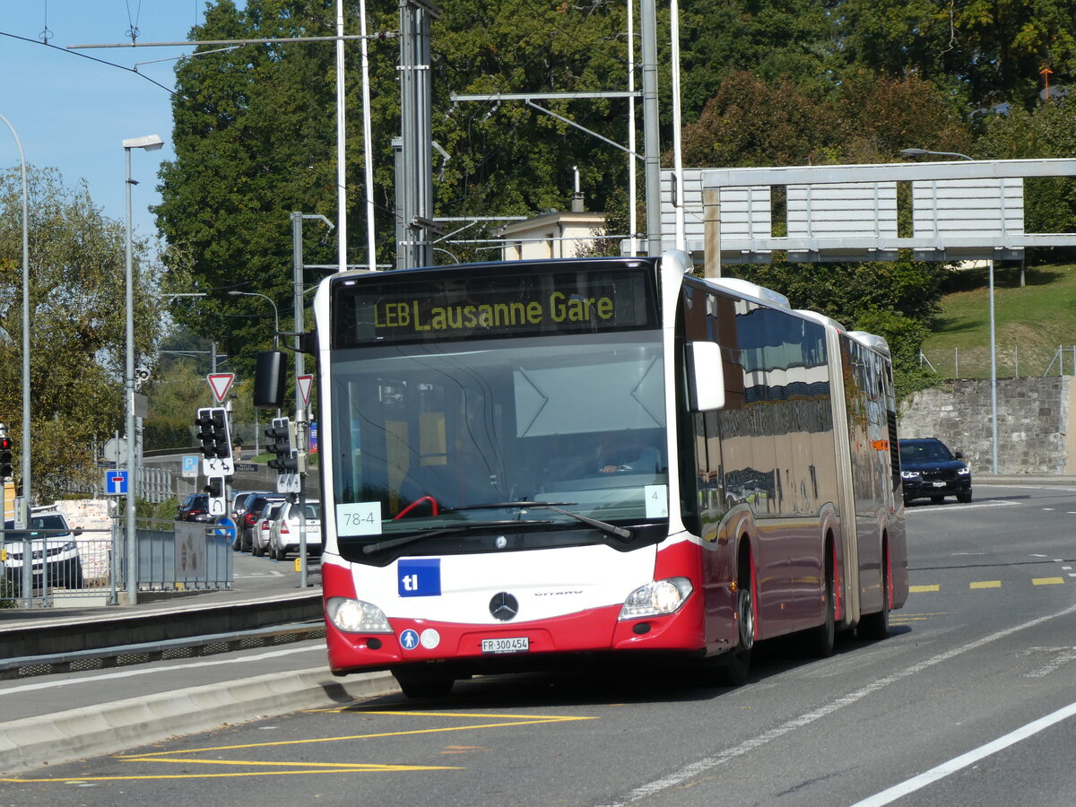 (228'831) - Intertours, Domdidier - FR 300'454 - Mercedes (ex A-Wien) am 11. Oktober 2021 beim Bahnhof Prilly-Chasseur (Einsatz TL)