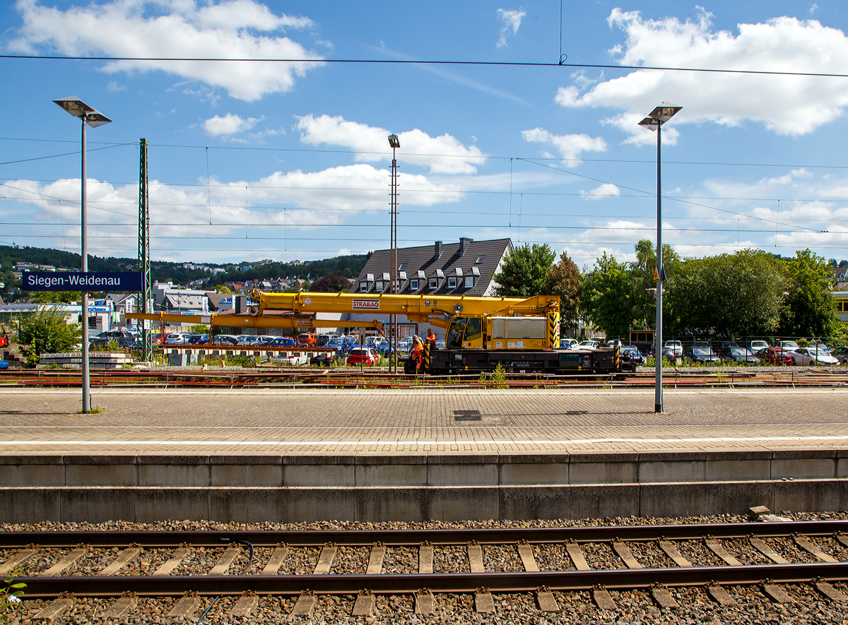 Der 50 t GOTTWALD Gleisbauschienenkran GS 50.09 T, Schweres Nebenfahrzeug Nr. 99 50 9219 028-9 CH-BRS „Werner“ der BMTI Rail Service GmbH (Servicebetrieb der STRABAG SE), ex VTmaas 99 85 92 19 028-9 VANOMAG AG Kran VIII, ex VTmaas 80 85 94 81 407-7, ist am 30.07.2021 im Bahnhof Siegen-Weidenau im Einsatz.

Der Kran wurde 2002 von Gottwald in Düsseldorf gebaut.

TECHNISCHE DATEN:
Spurweite: 1.435 mm
Anzahl der Achsen: 6 (in 2 Drehgestellen)
Länger über Puffer: 12.000 mm (ohne Kranausleger)
Drehzapfenabstand: 7.000 mm
Achsabstand im Drehgestell : 1.500 mm
Raddurchmesser: 920 mm (neu) 
Breite in Transportstellung: 3.100 mm
Höhe in Transportstellung: 4.200 mm
Eigengewicht: 116 t in Transportstellung (Gegengewicht abgelegt)
Traglast:  50.000 kg bei 3,0 m Ausladung vor Puffer 
  18.300 kg bei 12,5 m Ausladung vor Puffer
Kleinster befahrbarer Radius: 90 m 
max. Geschwindigkeit im Zugverband: 100 km/h
max. Geschwindigkeit im Eigenantrieb: 25 km/h
Bremse: KE-GP mZ (D)