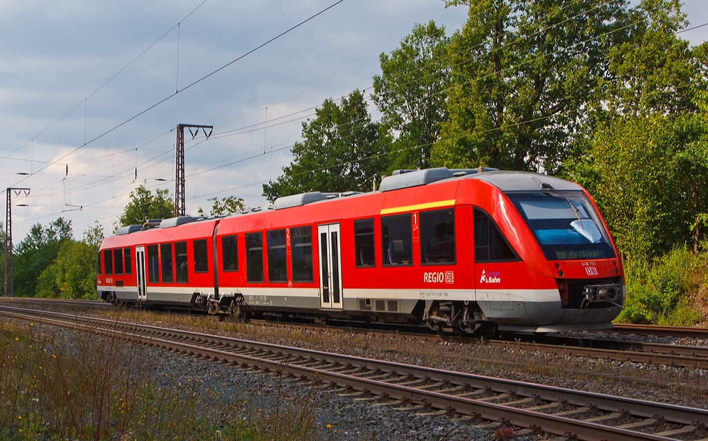 Der Alstom Coradia LINT 41 (Dieseltriebwagen) 648 203 / 703 der DreiLnderBahn als RB 95  Sieg-Dill-Bahn  (Dillenburg-Siegen-Betzdorf/Sieg-Au/Sieg) hat gerade (am 20.08.2013) den Bahnhof Rudersdorf (Kr. Siegen) verlassen und fhrt nun, auf der KBS 445 (Dillstrecke), in Richtung Siegen weiter.