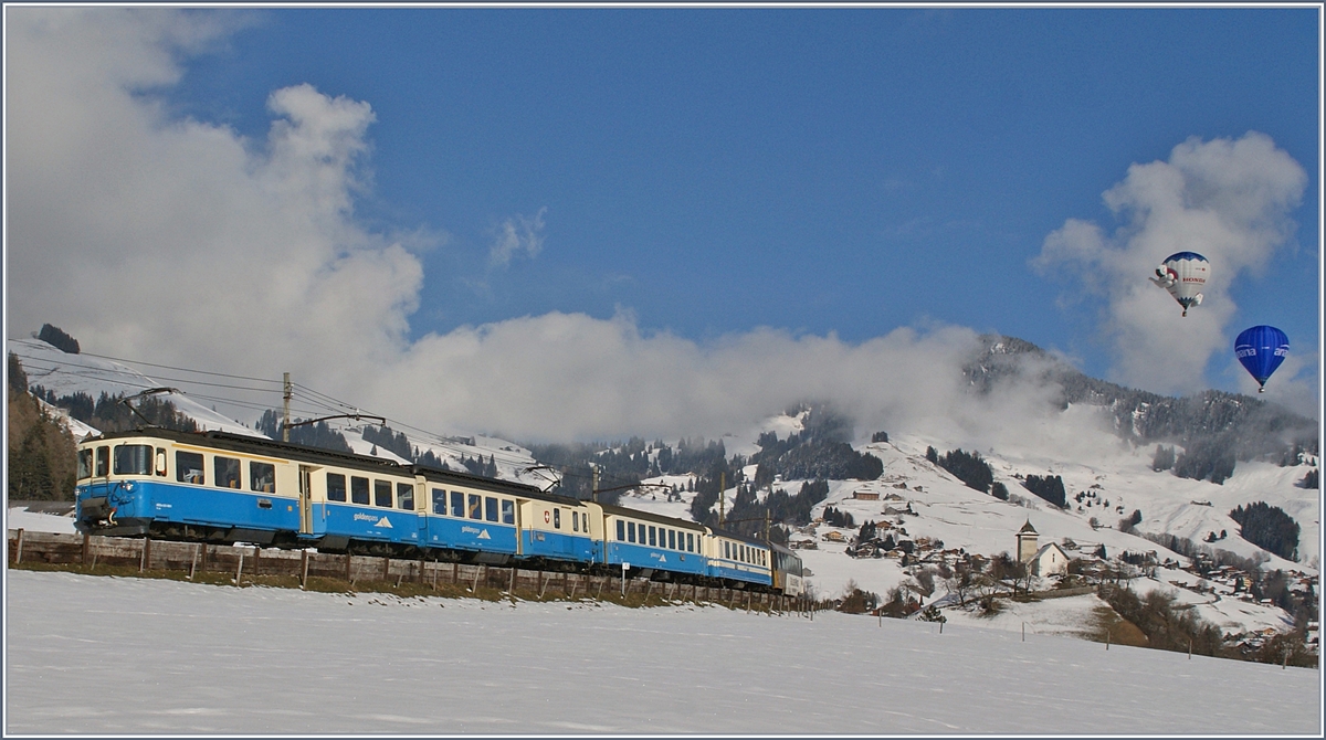 Der MOB ABDe 8/8 4001  SUISSE  mit einem Regionalzug nach Montreux kurz nach Château d'Oex, wo gerade das Ballon Festival statt findet.
28.02.2013