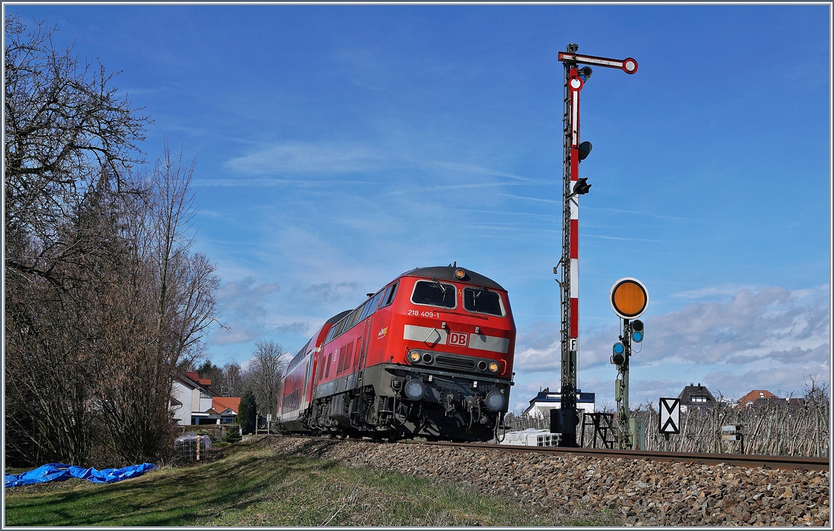 Die DB 218 409-1 mit ihrem RE von Aulendorf nach Lindau bei Einfahrsignal F von Nonnenhorn.

16. März 2019 
