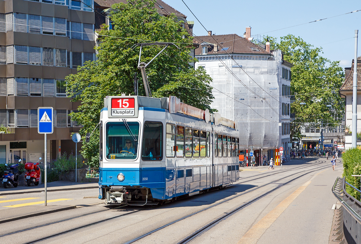 Die VBZ Tram 2000 (Be 4/6) Nr. 2050 fhrt am 07.06.2015 vom Bahnhof Zrich Stadelhofen, als Linie 15 (Klusplatz), gerade die Kreuzbhlstrasse hinauf.