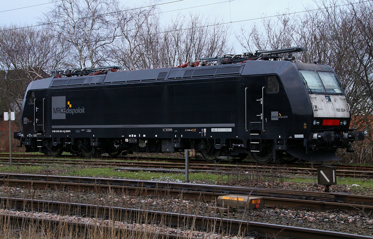 MRCE/CFL 185 554-3 mit frischer HU(Unt/Be/03.01.14)stand ebenfalls im Gbf Bereich in Padborg/DK. 06.02.2014