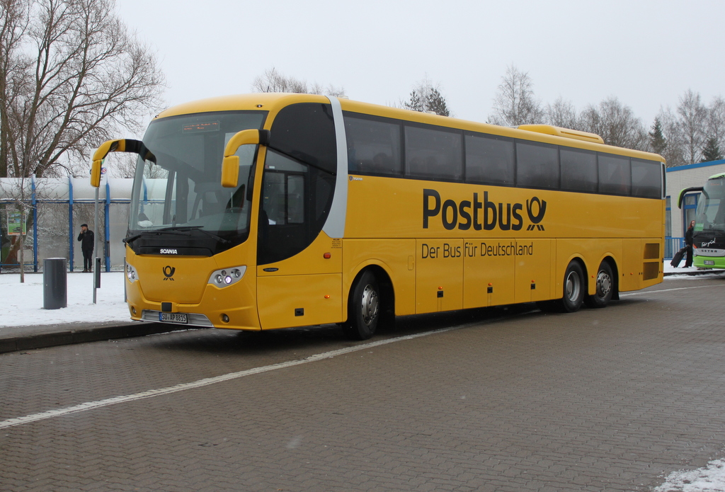 Postbus Scania OmniExpress stand als Linie 60 von Warnemnde nach Kln/Bonn Flughafen in Hhe Rostock Hbf/Sd.16.01.2016