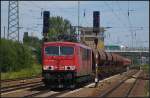 DB Schenker 155 132-4 mit einem Schotterzug am 23.07.2012 in Berlin Sch�nefeld Flughafen