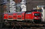 DB Regio 182 007 schiebt den RE1 nach Eisenh�ttenstadt am 07.04.2013 durch die typische H�userschlucht am Bahnhof Berlin Friedrichstra�e