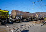 Vierachsiger 71 m Drehgestell-Kesselwagen 37 80 7834 783-8 D-VTG, der Gattung Zans, der VTG (Hamburg) vermietet an Henkel, am 14.02.2023 im Zugverband, eingereiht in den sogenannten  Henkelzug , bei