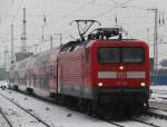 112 118-5 mit RB 13260 von Ribnitz-Damgarten West nach Rostock Hbf bei der Einfahrt im Rostocker Hbf.14.12.2012