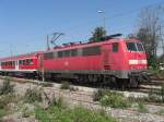 111 018-8 kurz nach der Ausfahrt aus dem berseer Bahnhof.