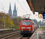  Die 111 119-4 (91 80 6111 119-4 D-DB) der DB Regio mit dem RE 9 (rsx - Rhein-Sieg-Express) Aachen - Köln - Siegen erreicht am 26.11.2016 den Bahnhof Köln Messe/Deutz.