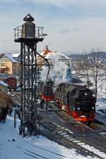   Die Neubau-Dampflok der Harzer Schmalspurbahnen HSB 99 7243-1 (ex DR 099 153-9, ex DR 99 0243-8, ex DR 99 243) am 23.03.2013 beim Wasserfassen im BW Wernigerode.