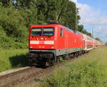112 148 mit DZ 13290(Warnemünde-Berlin)bei der Durchfahrt in Rostock-Bramow.03.06.2025