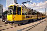 Straßenbahn / Stadtverkehr; Berlin;      Tatra CKD Nr.6057 am Alexanderplatz am 30.09.2013;  Zu beachten ist die Spiegelung in den Tram-Fenstern mit dem Karrussel.