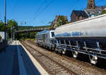 Die 248 059 alias DM4003 (90 80 2248 059-8 D-RHC), eine SIEMENS Vectron Dual Mode, der RheinCargo f�hrt am 28 Juli 2026 mit einem Kalkzug durch den Bahnhof Kirchen (Sieg) in Richtung K�ln.