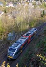 kbs-462-hellertalbahn/423181/ein-stadler-gtw-26-der-hellertalbahn 
Ein Stadler GTW 2/6 der Hellertalbahn als RB 96 'Hellertalbahn' (Neunkirchen-Herdorf-Betzdorf/Sieg) hat am 24.04.2015 gerade den Hp Grünebach Ort verlassen und fährt nun weiter in Richtung Betzdorf.  

Neben dem noch aktiven Gleis der KBS 462 (Hellertalbahn), liegt hier noch das alte zweite Gleis, der einstigen zweigleisigen Hauptstrecke. Durch die Bäume hindurch noch zuerkennen, verläuft hier neben der Strecke die Heller. 

