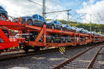 Vierachsiger (2 x zweiachsiger) Doppelstock-Autotransportwagen der Gattung Laaers 560.1 (BA 5.854) der DB Cargo Logistics GmbH (ex DB Schenker ATG) eingestellt als 25 80 4371 621-0 D-ATG am 24 Oktober 2026 im Zugverband, beladen mit Autos der vier Ringe (Audi), bei der Zugdurchfahrt in Betzdorf/Sieg in Richtung K�ln.

Diese Wagen wurden ab ca. 2010 von der damaligen DB Waggonbau Niesky GmbH gebaut. Die Waggons haben zwei Ladeebenen und sind f�r den europaweiten Transport geeignet. Sie werden f�r den internationalen Transport von PKWs, SUVs und Vans eingesetzt und bieten maximale Flexibilit�t durch eine stufenlos verstellbare obere Ladeebene. Aufgrund der hohen Lastgrenze (bis 34 t) ist der Transport von besonders schweren Fahrzeugen der genannten Typen m�glich.

Damit sowohl ein typenreiner Transport als auch eine Mischverladung in den unterschiedlichen Ladema�en m�glich ist, kann die obere Ladeebene hinsichtlich der Transportstellungen stufenlos eingestellt werden.

Durch die Entwicklung eines ver�nderten Ladungssicherungssystems wurde den Kundenanforderungen nach optimierten Transportm�glichkeiten f�r Fahrzeuge mit niedrigerer Bodenfreiheit Rechnung getragen.

TECHNISCHE DATEN:
Gattung: Laaers (Bauart 560.1)
Erstes Baujahr der Wagengattung: 2007
Spurweite: 1.435 mm (Normalspur)
Anzahl der Achsen: 4 (2 x 2)
L�nge �ber Puffer: 31.000 mm
Achsabst�nde: 10.000 mm / 5.160 mm / 10.000 mm
Laufraddurchmesser (neu): �u�ere 840 mm und mittlere 730 mm
Ladel�nge: 30.070 mm (unten) / 30.550 mm (oben)
Ladel�nge waagerechter Teil untere Ebene: 19.400 mm
Ladebreite: 2.950 (unten) / 2.750 mm (oben)
H�chstgeschwindigkeit: 100 km/h (120 km/h leer)
Eigengewicht: 31.000 kg
Max. Zuladung bei Lastgrenze S: 33,0 t (ab Streckenklasse B, bei A 29,0 t)
Max. Zuladung der Ladeebenen: unten und oben jeweils max. 18 t
Max. Gewicht je Pkw: 2.800 kg (Radlast max. 1 t)
Anzahl der Radvorleger: 64
H�he Gel�nder oben: 600 mm
Kleinster befahrb. Gleisbogenhalbmesser: 75 m
Bremse: KE-GP-A (K)
Bremssohle: Jurid 816 M
Handbremse: Ja
Intern. Verwendungsf�higkeit: TEN-GE / G1