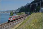 Der FS Trenitalia ETR 610 002 ist als EC 32 von Milano nach Genève unterwegs und fährt beim Château de Chillon geradewegs in den dunklen Schatten einer Gewitterwolke.