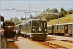 RhB Ge 6/6 I 412 mit ihrem Güterzug wartet in Filisur an der Rampe, währen die Ge 4/4 II 617 mit ihrem Albula-Schnellzug nach St.