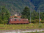 Die BLS Re 4/4 182 „Kandergrund“ / Re 425 182 (91 85 4425 182-3 CH-BLS) fährt am 02.08.2019 als Lz (solo) über die einspurige Güterzugumfahrung Domodossola zum Rangierbahnhof Beura-Cardezza (ex Rbf Domodossola II). Diese Strecke ist mit 15 kV 16,7 Hz Wechselstrom elektrifiziert. 

Die Re 4/4 wurde 1974 von der Schweizerische Lokomotiv- und Maschinenfabrik (SLM) in Winterthur unter der Fabriknummer 5038 gebaut, die elektrische Ausrüstung ist von BBC.
