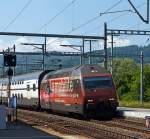 Re 460 094-6  Raetia  (mit Werbung fr Carsharing Schweiz) mit DoSto IC kommt von Lausanne und fhrt am 28.05.2012 in den Bahnhof Palzieux ein.
