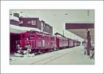 FO Furka-Oberalp-Bahn/324700/die-fo-hge-44-i-n176 Die FO HGe 4/4 I N° 33 wartet in Andermatt auf  die Abfahrt nach Disentis.
Fotografiertes 110-Film Bild; 13. März 1982