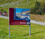 Das Werbeschild für MGB Realp im Kanton Uri, mit Werbemotiv der DFB Dampfbahn Furka-Bergstrecke, am 07.09.2021kurz vor der Einfahrt in den MGB Bahnhof Realp (1.538 m ü.