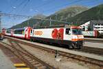 RhB Ge 4/4 III Nr.641 mit Werbung Coop mit Glacier-Express in Samedan am 19.08.2009.