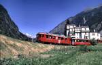 RhB ABe 4/4 mit Bernina-Express befhrtdas Kehrviadukt bei Brusio im August 1989.