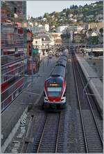 Die beidne SBB RABe 511 114 und 115 haben als RE33 nach Annemasse den Bahnhof von Montreux erreicht.

29. April 2025