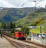 Die letzte, die Tunnellokomotive MGB Ge 4/4 III - 81 „Wallis“ der Matterhorn-Gotthard-Bahn ex FO Ge 4/4 III - 81, steht am 07.09.2021mit einem Furka-Autoverladezug beim Bahnhof Realp